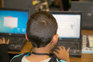 photo of boy at computer